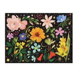 Close-up of Intergalactic Flora puzzle by Galison with 1000 pieces with colorful flowers and shimmering stars