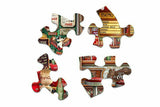 Close-up of Coca-Cola History puzzle pieces by Springbok with vibrant retro diner details