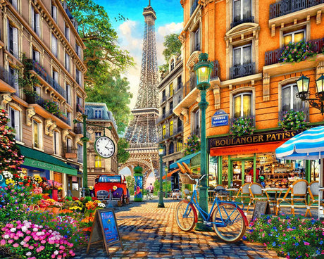 Spring Walk, Paris 1000-piece jigsaw puzzle from The Puzzle Center featuring a vibrant street scene with the Eiffel Tower, blooming flowers, and charming cafés.