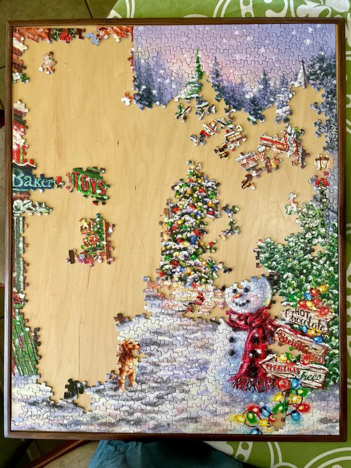 High-quality 1000 piece jigsaw puzzle by Springbok featuring a festive main street at Christmas time