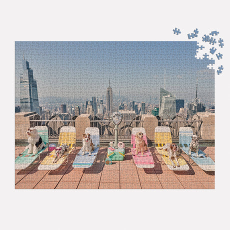 Close-up of Gray Malin Dogs of New York City puzzle pieces featuring city dogs