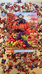 High-quality 500 piece jigsaw puzzle by Springbok featuring a harvest cornucopia and friendly scarecrow