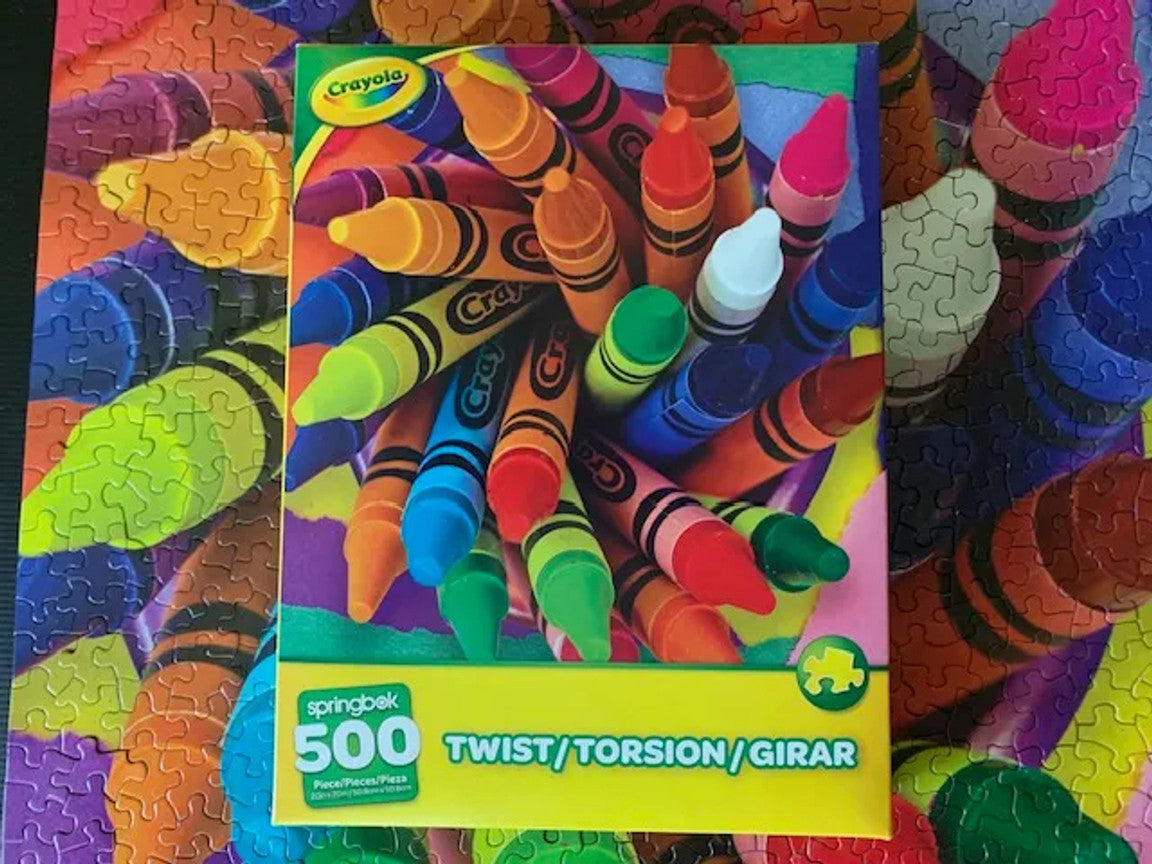 Box and puzzle of the Crayola Twist 500-piece jigsaw puzzle featuring vibrant colors