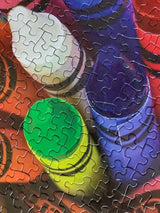 Close up of the Crayola Twist 500-piece jigsaw puzzle featuring vibrant colors