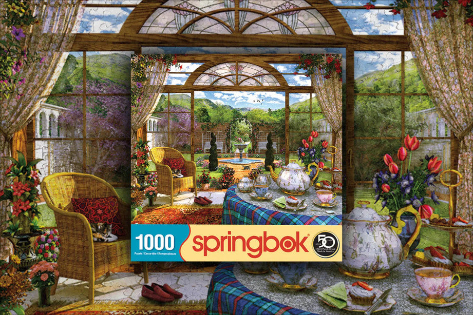 Peaceful scene puzzle showing a conservatory with a tea setting and a lush garden view, perfect for relaxing moments