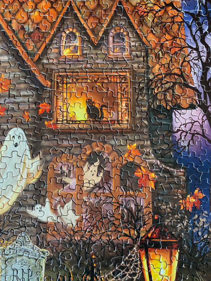 Completed Haunted House puzzle showcasing spooky details and supernatural elements