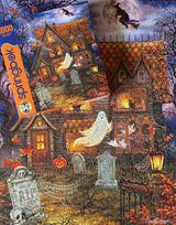 Close-up of Haunted House puzzle pieces with ghost and witch flying through night sky by Springbok