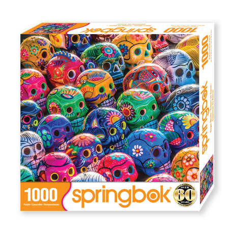 Box for Springbok 1000-piece jigsaw puzzle of vibrant sugar skulls in celebration of the Day of the Dead