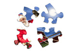 Puzzle pieces of the holiday jigsaw puzzle featuring Santa, his sleigh, and a picturesque snow-covered village by Springbok