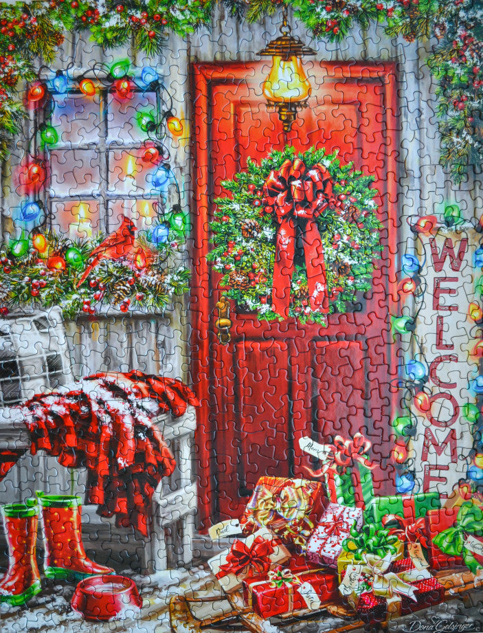 Completed Home for the Holidays puzzle by Springbok with 500 pieces - charming holiday scene and sleigh full of presents