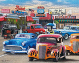 Completed puzzle Classic Car Show jigsaw puzzle featuring vintage cars in front of a Route 66 diner by Springbok