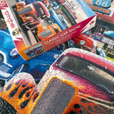 Springbok 1000-piece puzzle showing hot rods and classic vehicles at a retro diner and ice cream shop