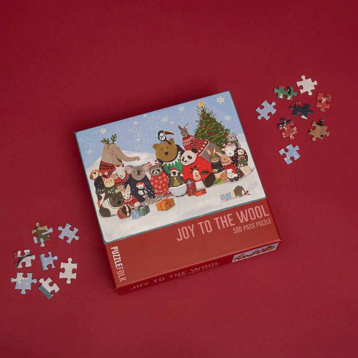 Joy to the Wool Puzzlefolk 500 piece Christmas puzzle box with colored poster