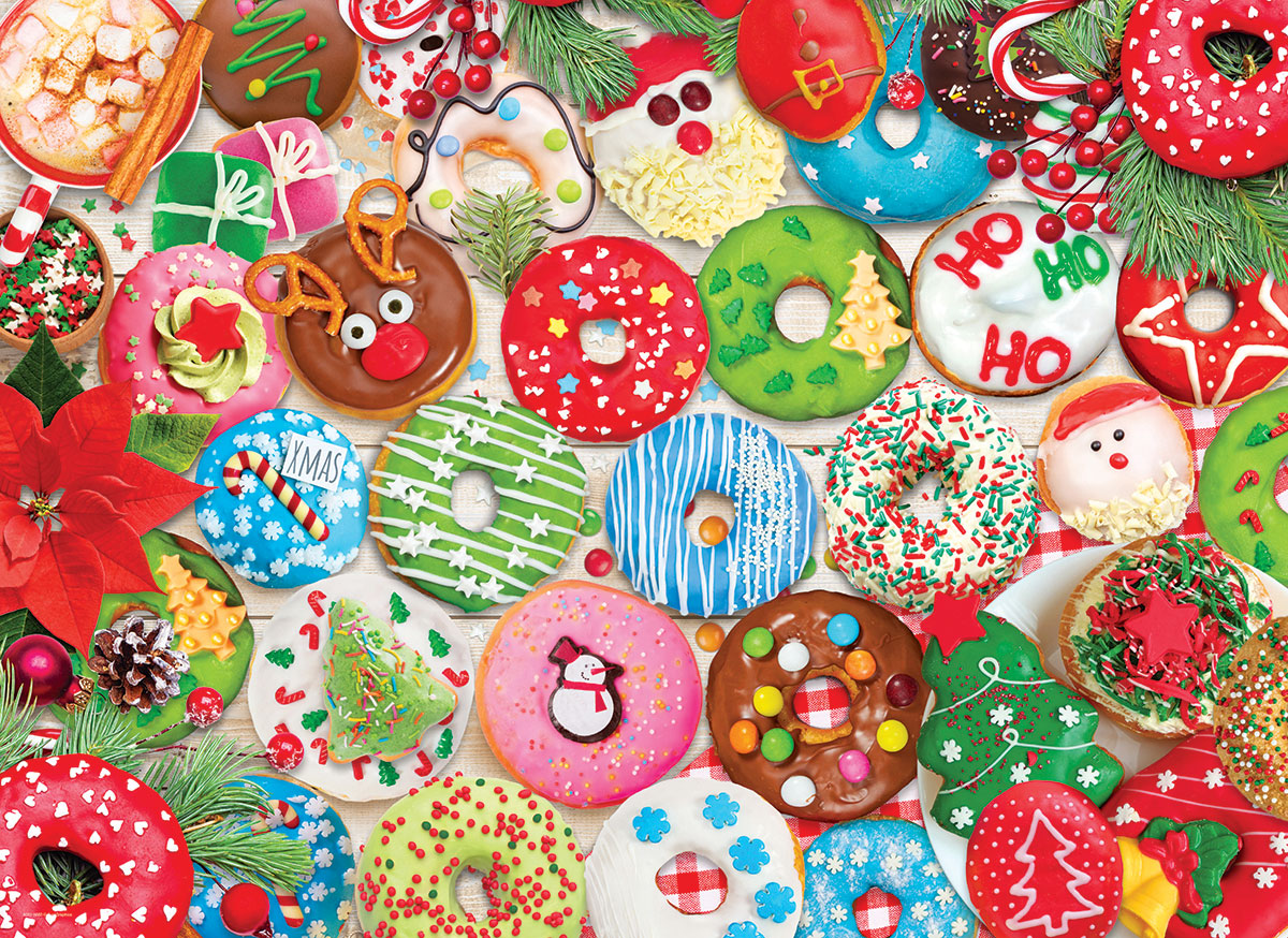 Collectible tin and pieces of the Christmas Donuts jigsaw puzzle