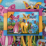 1000 piece jigsaw puzzle of whimsical cats in a colorful garden by JaCaRou