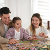 Family working the Dog-themed jigsaw puzzle featuring multiple breeds enjoying an autumn stroll, by Boardwalk