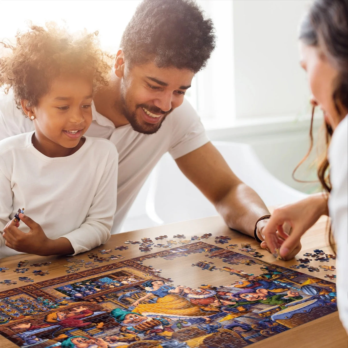 Family putting together the Snow White Dancing with the Dwarfs 500-piece puzzle by Disney and Dowdle