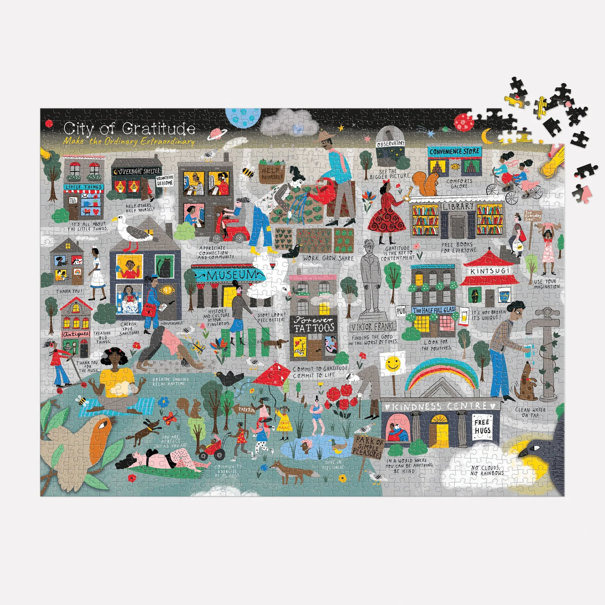 Close-up of City of Gratitude puzzle pieces with inspiring text and playful designs