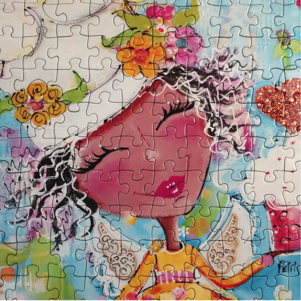 Close up of angel-themed jigsaw puzzle by JaCaRou 20 x 27 inches with larger puzzle pieces