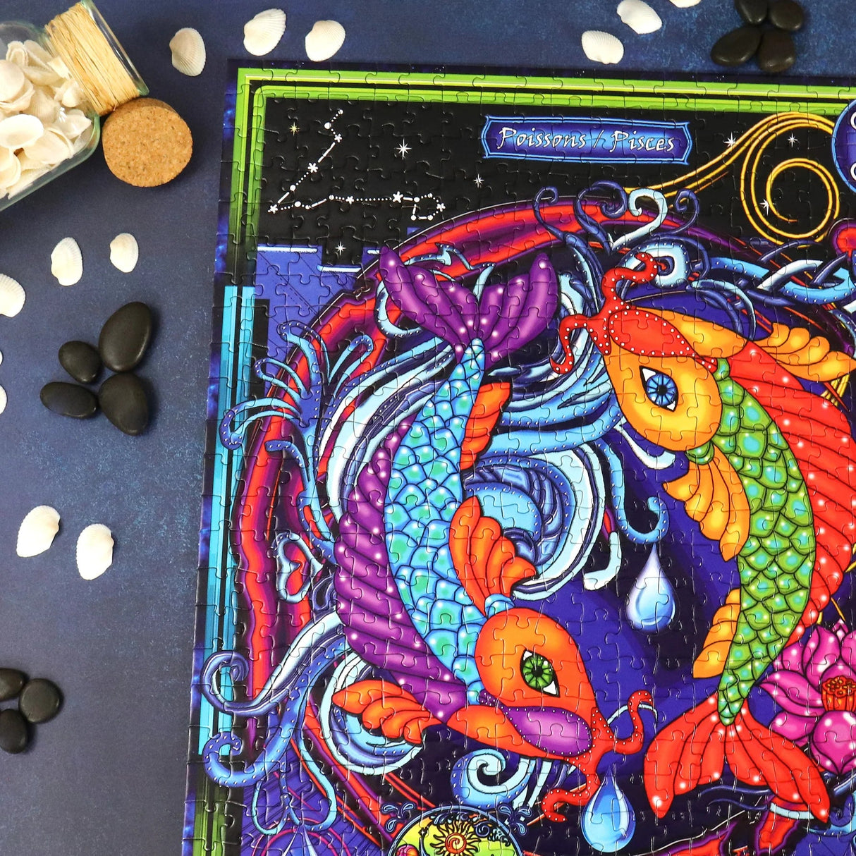 Close-up of vibrant zodiac-themed puzzles from the Water Signs Multipack by JaCaRou